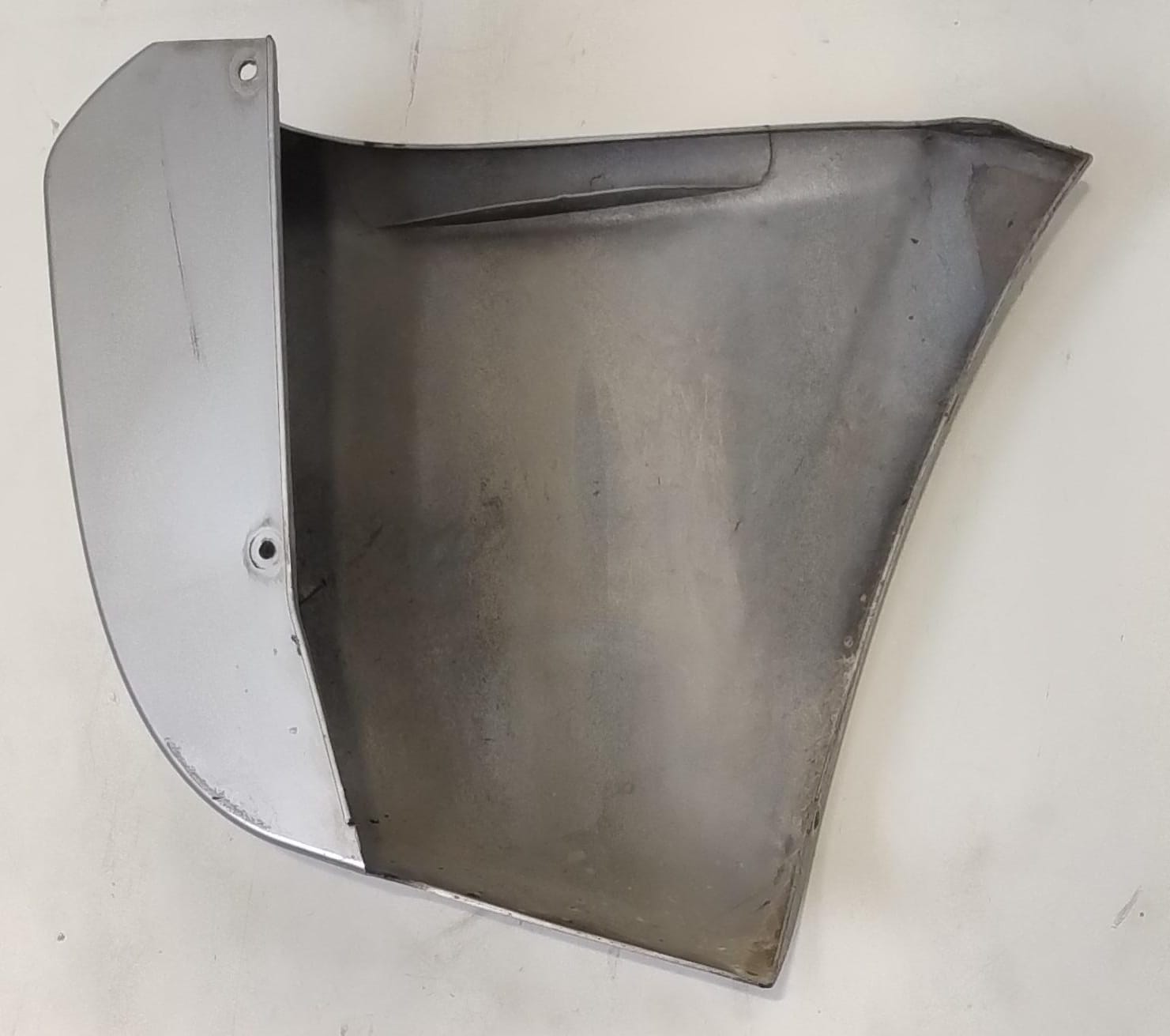 Paraurti post. lato sx.