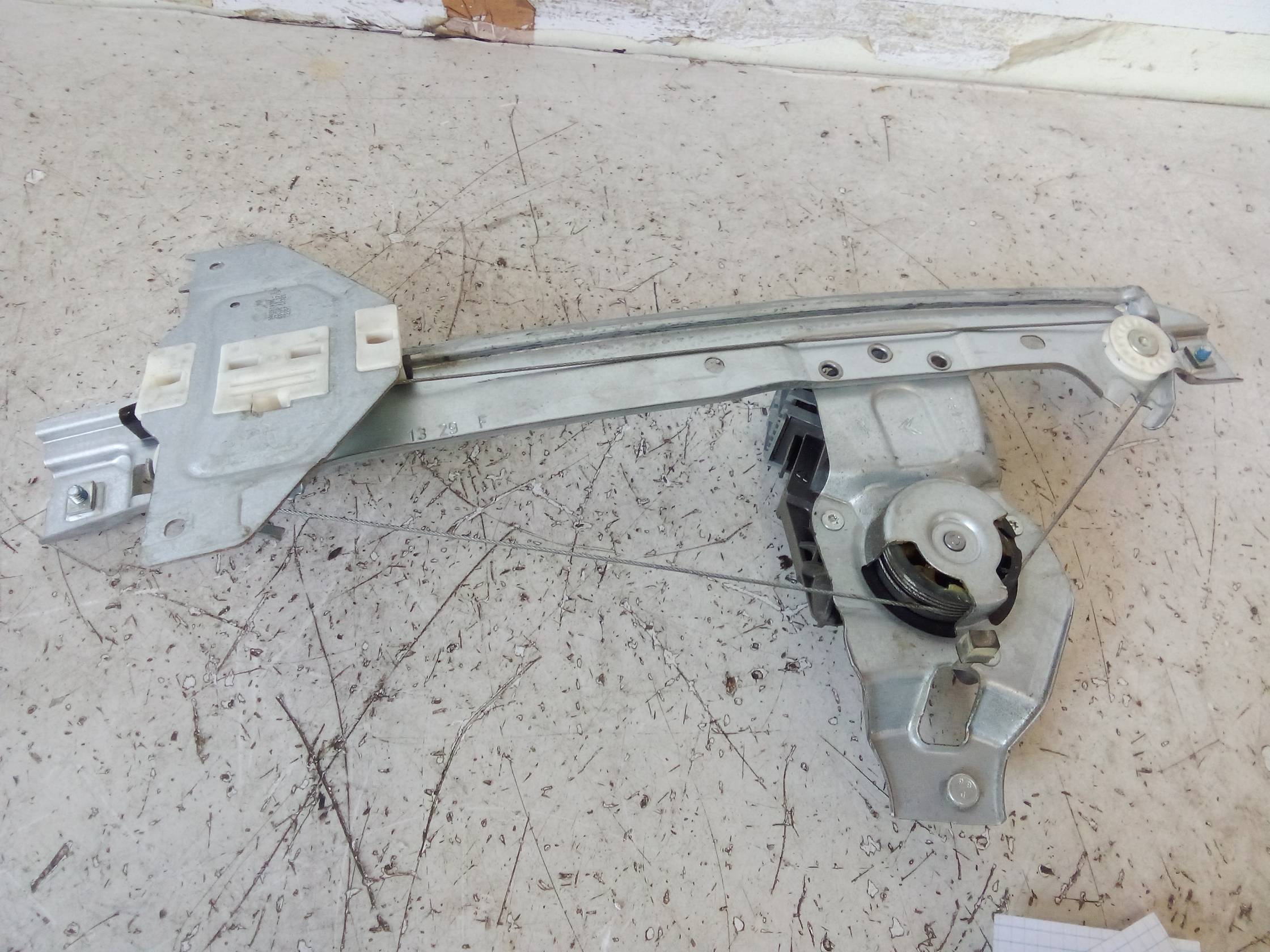 Alzacristallo elettr. porta post. sx.