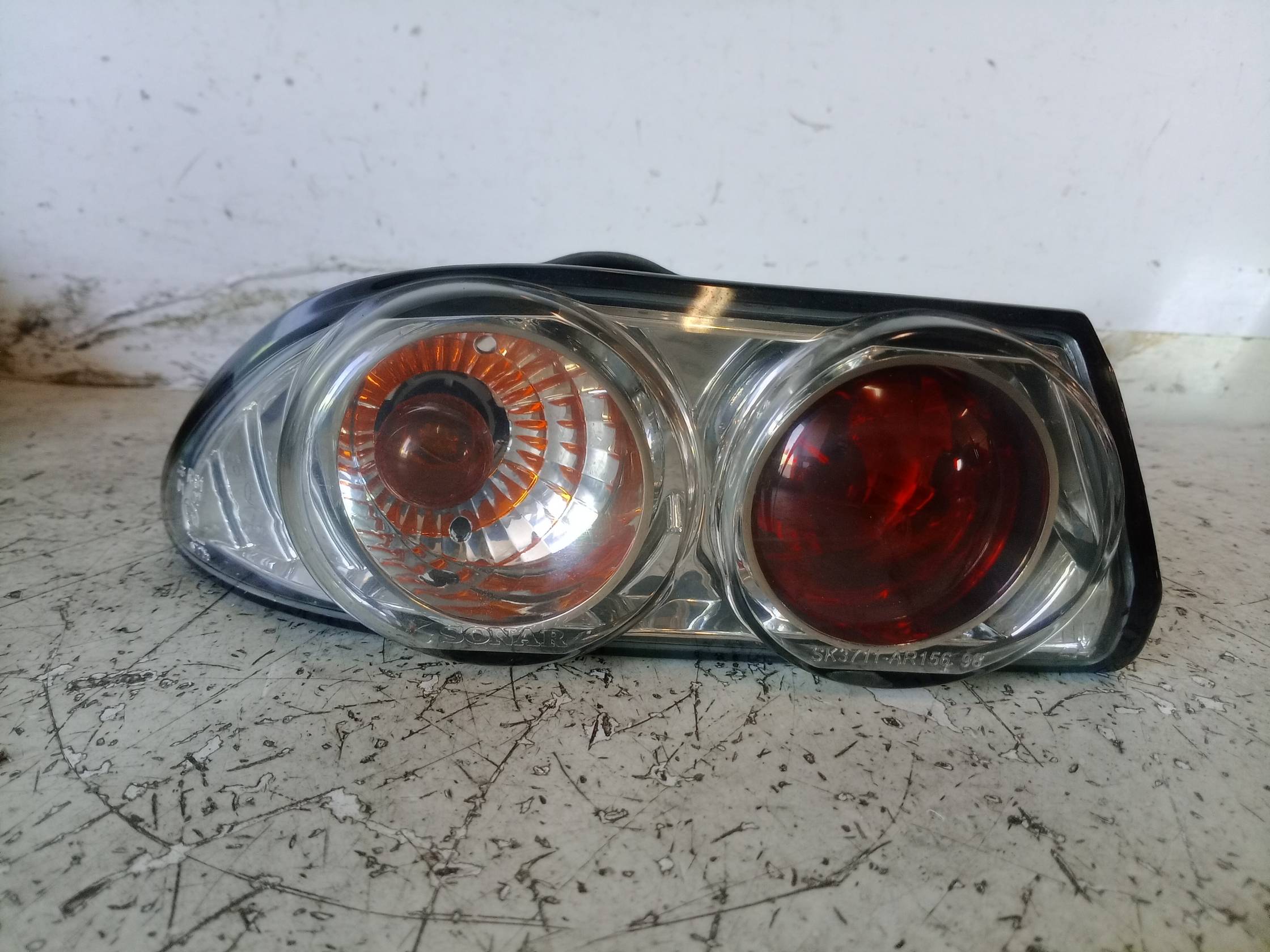 Fanale post. parte est. sx.