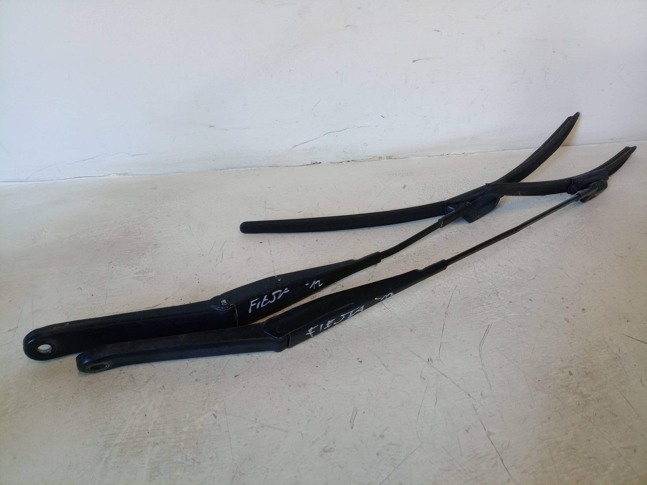 Braccio tergiparabrezza sx.